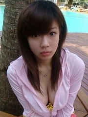 Selfmade photos of Busty and Gorgeous Asian girlfriend at home